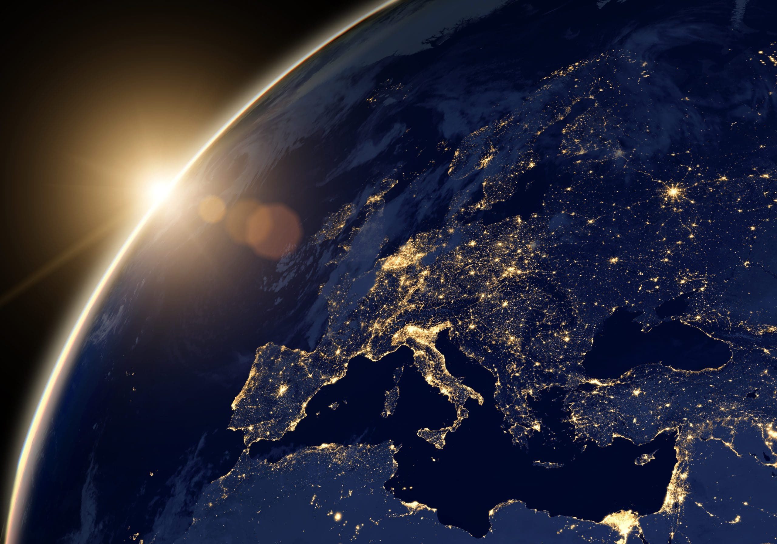 Planet Earth at night, view of city lights showing human activity in Europe and Middle East from space. World map on dark globe at sunrise on satellite photo. Elements of this image furnished by NASA.